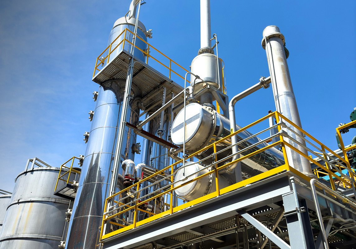 Stainless steel process plant with yellow walkways
